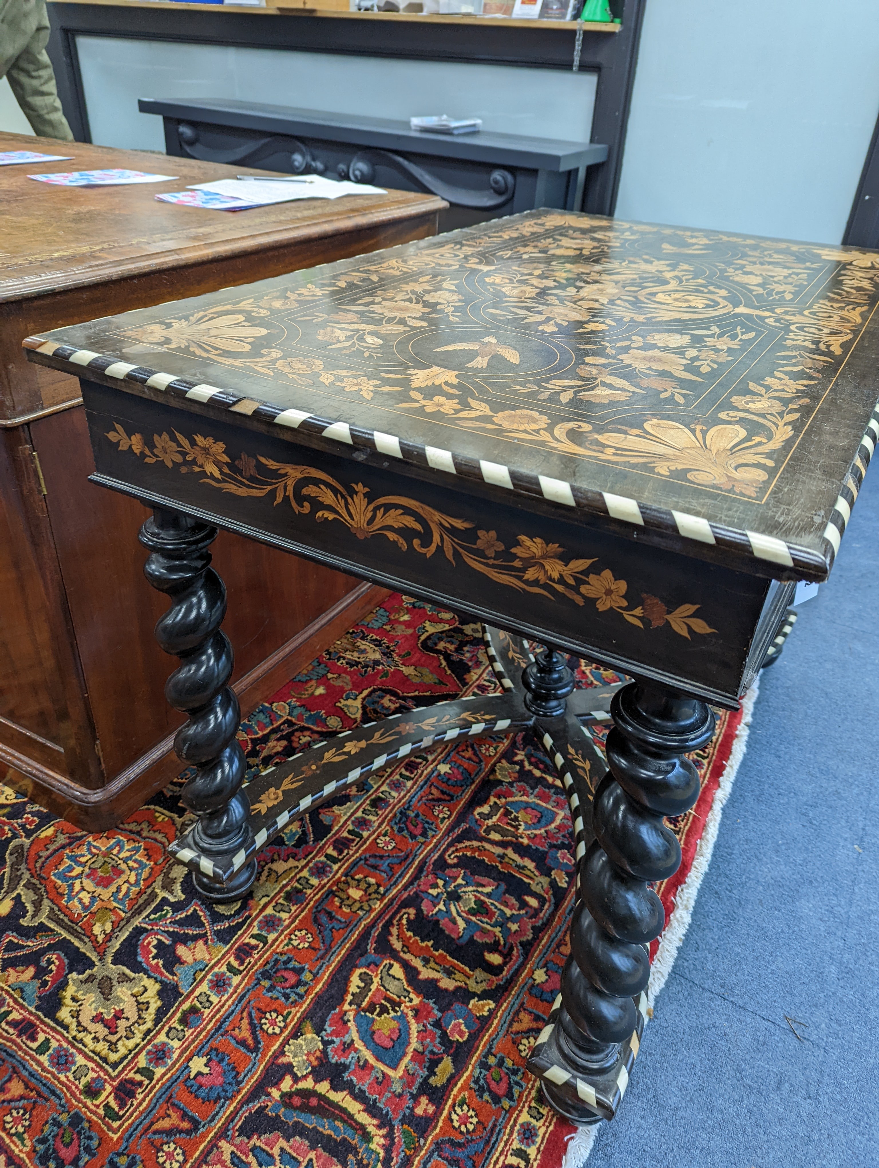 A William and Mary style rectangular marquetry and bone inlaid walnut side table, fitted drawer on ebonised spiral turned under frame with shaped X stretcher width 110cm, depth 67cm, height 78cm